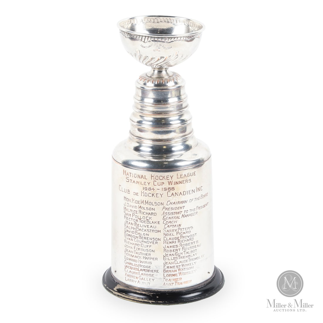 Claude LaRose's 1964-1965 Montreal Canadiens Personal Stanley Cup Trophy: Offered here is Claude LaRose's player-issued Stanley Cup trophy commemorating the Montreal Canadiens' 1964–1965 championship. Standing a stately 13 inches, the trophy is mounted upon a wooden