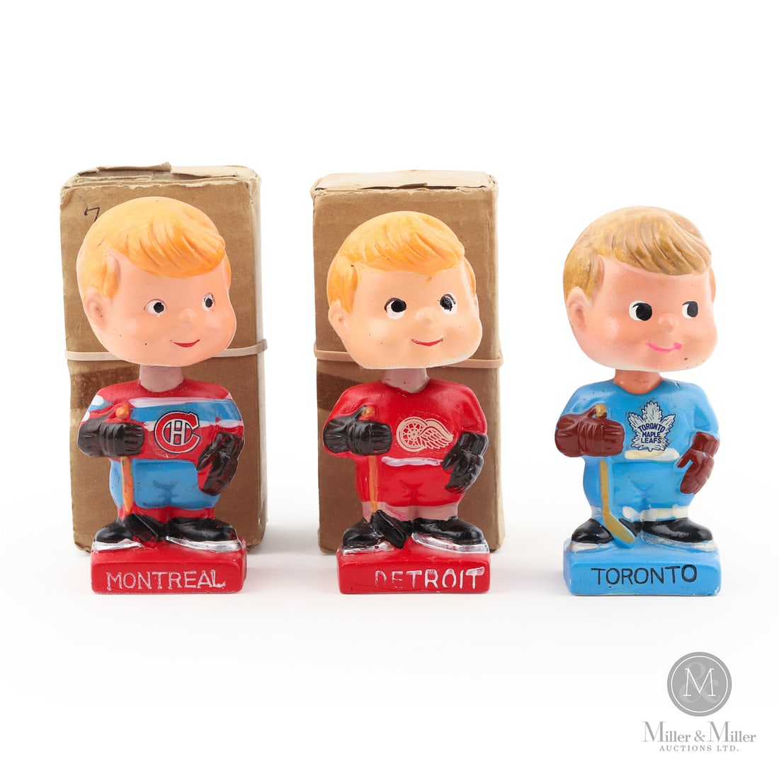 Trio of 1961-1963 Hockey Mini Nodders: The 1960s bobblehead "Nodders" offered here include Toronto, Montreal, and Detroit, with the Montreal and Detroit examples residing in their original boxes. All items are guaranteed authentic by