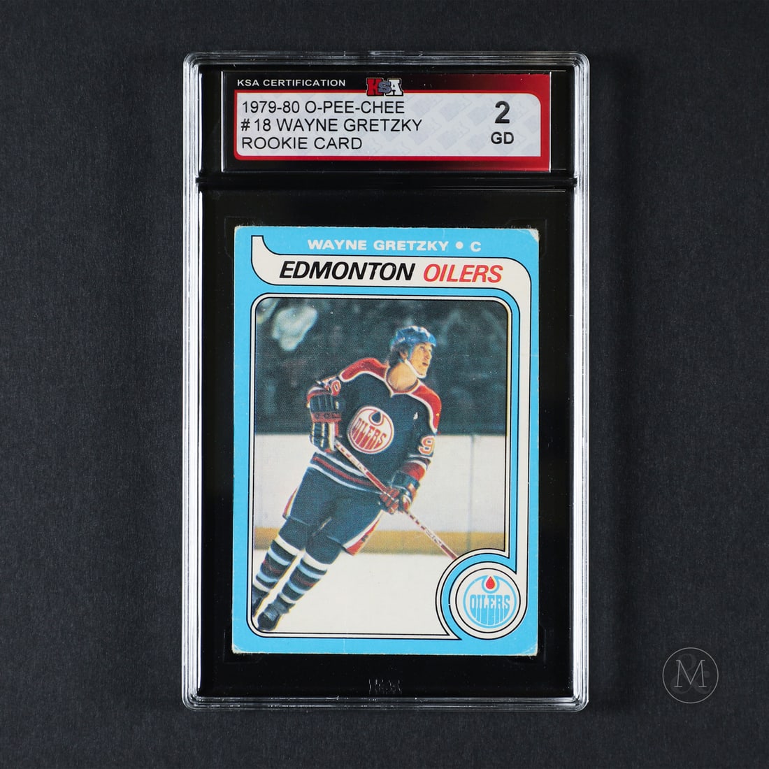 1979-1980 O-Pee-Chee #18 Wayne Gretzky (KSA 2 G): The 1979-1980 O-Pee-Chee Wayne Gretzky rookie card is one of the most iconic and highly sought-after cards in hockey history. Featuring "The Great One" in his Edmonton Oilers uniform, this card marks 