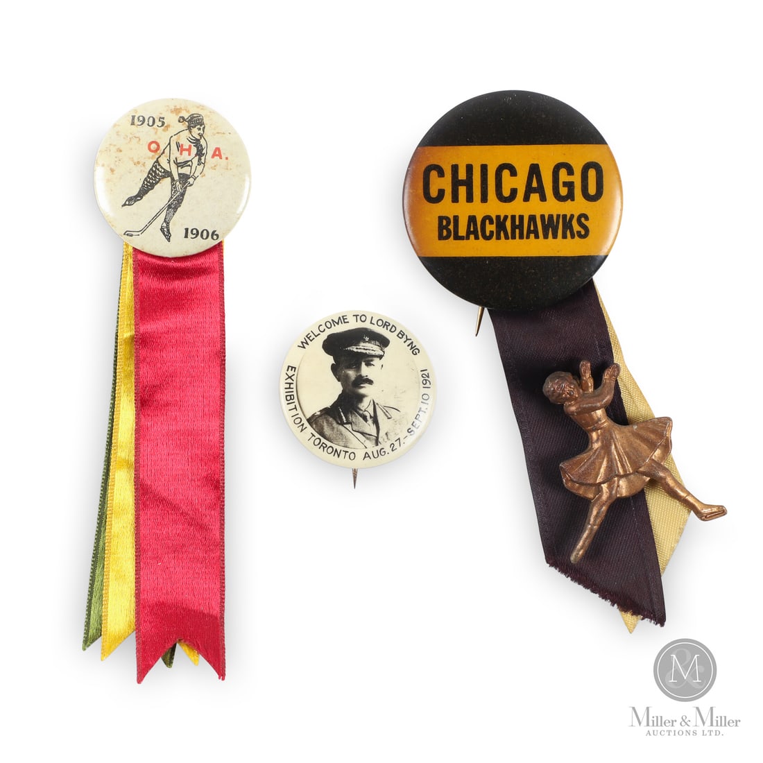 Trio of Early Hockey Pins: The trio of pins offered here show three examples from the early days of hockey. The earliest of the three is a 1905-1906 Ontario Hockey Association pin featuring a full player image. That year, the
