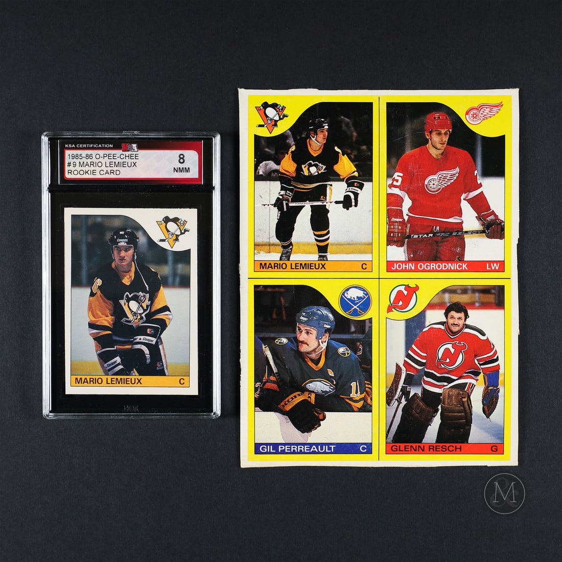 1985-1986 O-Pee-Chee #9 Mario Lemieux and Box Bottom: The 1985-1986 O-Pee-Chee Mario Lemieux represents one of hockey's greatest stars in his rookie season. Mario Lemieux is widely regarded as one of the greatest hockey players of all time, known for