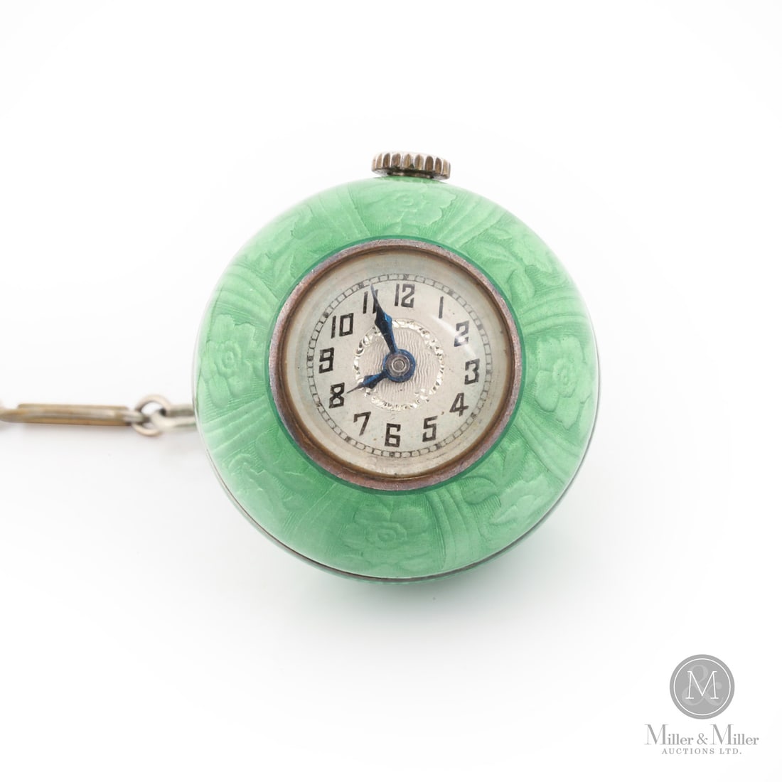 Art Deco Enamelled Pendant Ball Watch: Swiss. Enameled sterling silver. This Art Deco pendant watch is a vibrant example of the geometric and decorative flair that defined the early 20th century. The centrepiece is a stunning green guilloc