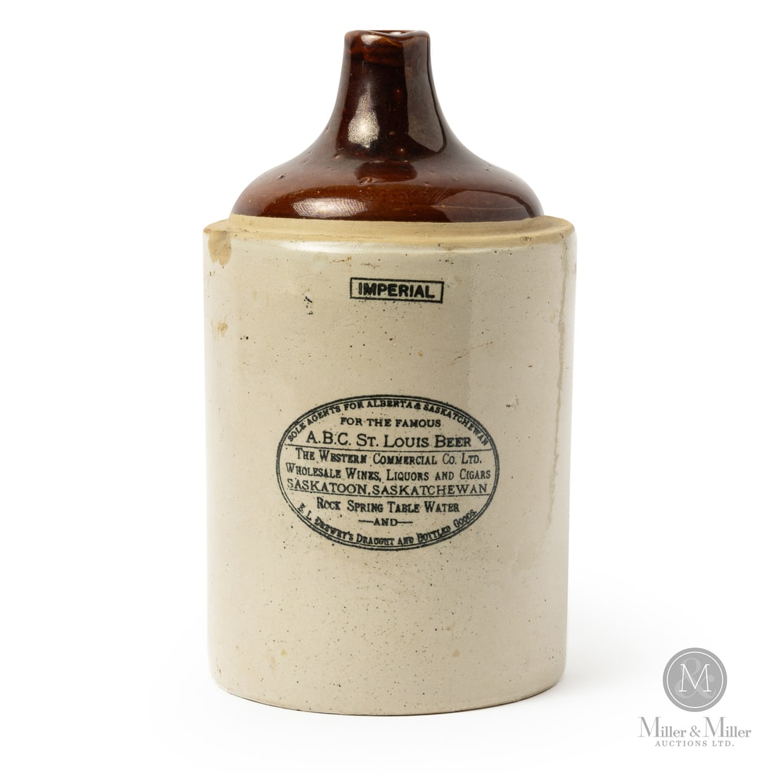 Western Commercial Co, Saskatoon 2 Gal Jug: Size 12.25" x 7" dia. Medium Stoneware.