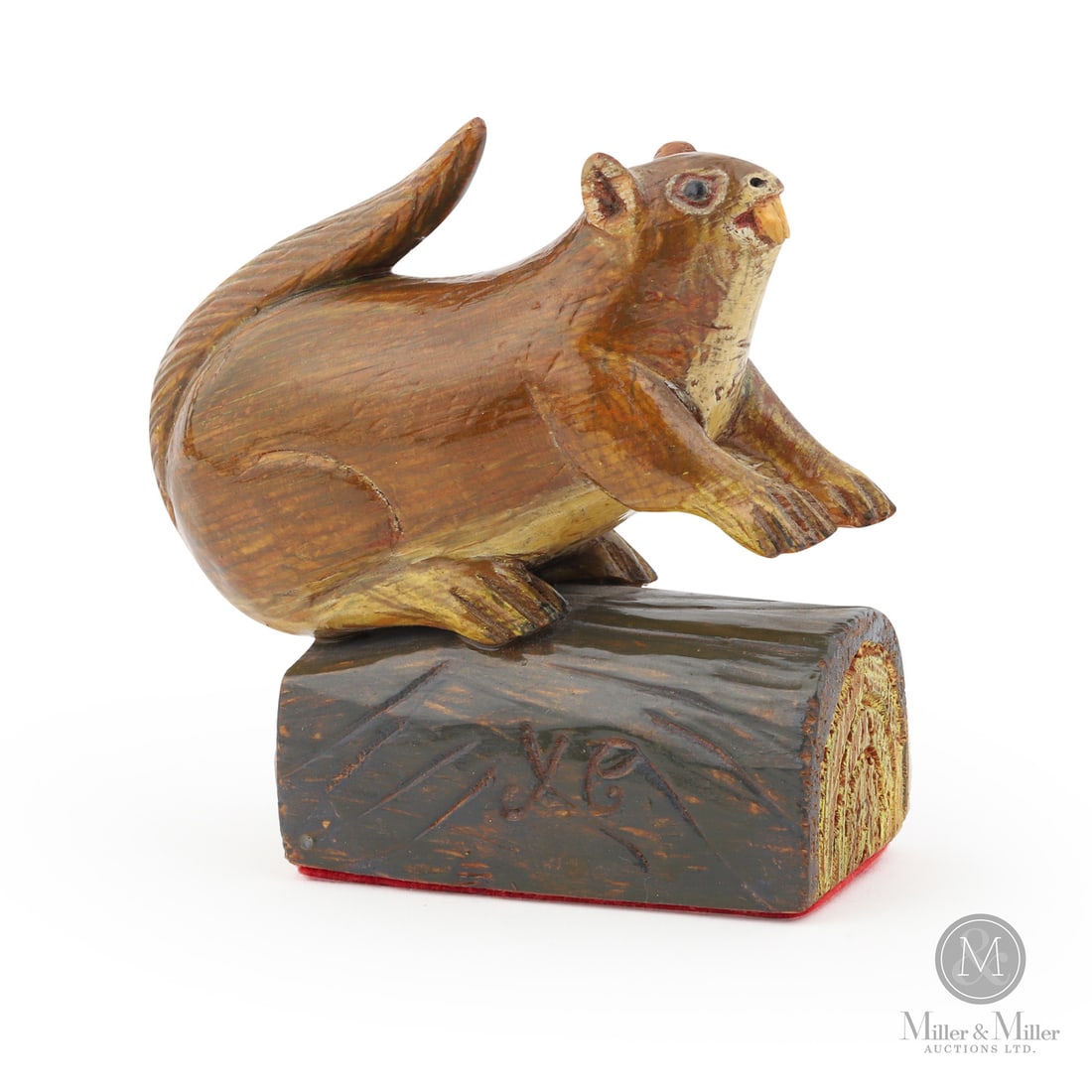 Yvon Coté Squirrel: Grande-Vallée, Québec. C. 1980. Painted wood. Perched alertly atop a carved log base, this squirrel is rendered with remarkable energy and character. The exaggerated curling tail sweeps dramatically
