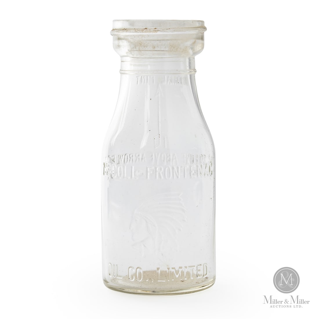 McColl-Frontenac Pint Oil Bottle: 1927 - 1941. Embossed. Minor chip to inner lip. Shelf wear underneath. Grease accretion inside (floor). 7.5" x 3" Dia. Size 7.5" x 3" Dia. Condition Minor chip to inner lip. Shelf wear underneath.