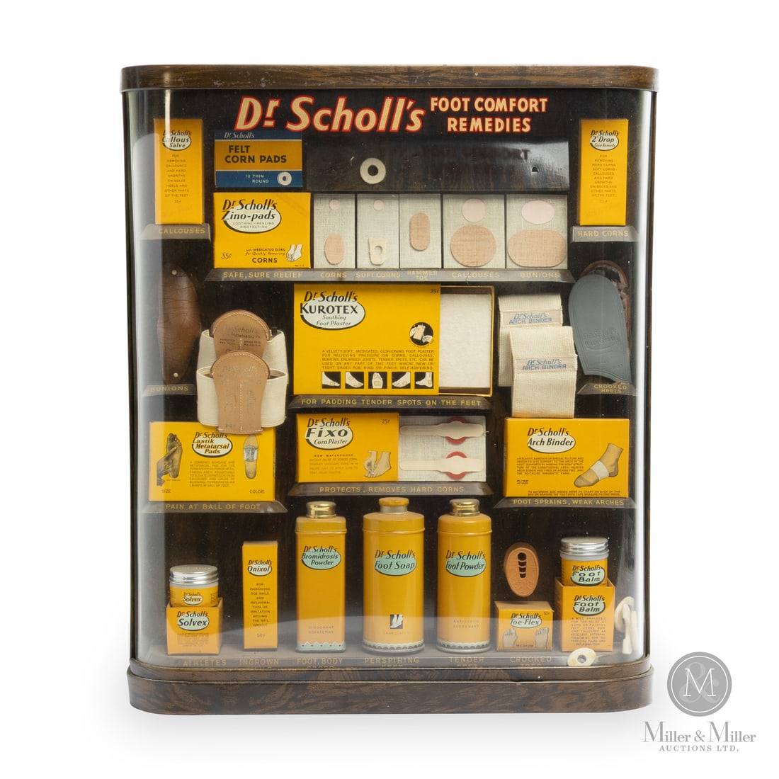 Dr. Scholl's Remedies Assortment Display: 1950s. Lithographed tin. Dr Scholl's "Foot Comfort" trademark was registered on December 28, 1948. All items are guaranteed authentic by Miller & Miller Auctions. All purchases are eligible for free