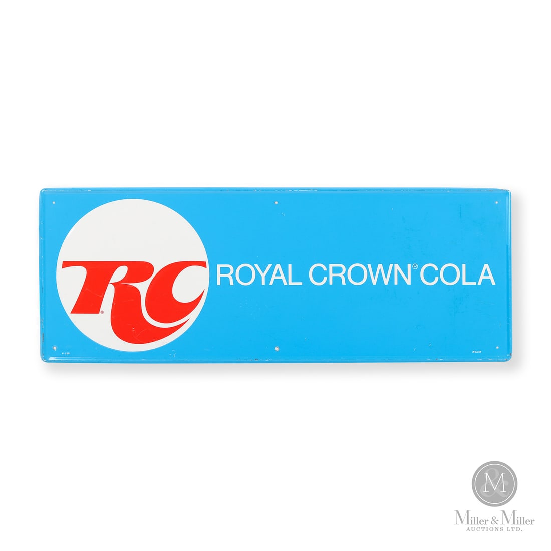 Royal Crown Cola Door Kick Sign: 1969-1989. Single-sided tin (SST). Embossed. Excellent colour and gloss. Paint nicks surrounding mounting holes. Scuffs, scratches, impressions, and paint nicks, particularly to raised border.