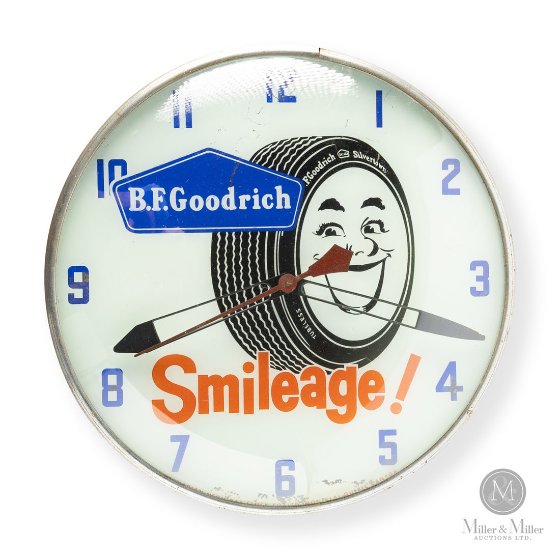 B.F. Goodrich "Smileage" Clock: 1958-1961. Reverse glass dial. The "Smileage" slogan was a major marketing push that combined the words "mile" and "smile" to promote the idea of worry-free driving. The tire in the centre references