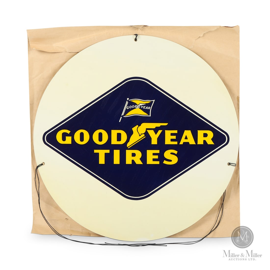 Good Year Tires Insert Sign: 1960s. Single-sided tin (SST). Circular. Excellent colour and gloss. Oxidation, spidering from upper right quarter edge. FIne scratches. Rice paper burn. Retains rice paper sleeve and suspension