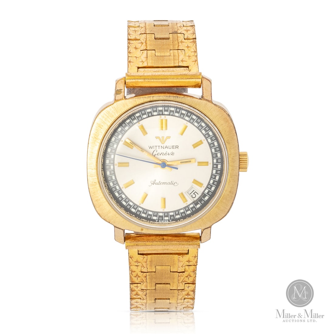 Wittnauer, Genève Automatic Date: Swiss. Gold-plated. The Wittnauer Genève Automatic is a 1970s statement piece featuring a distinctive gold-plated cushion-tonneau case and a matching integrated bracelet. The dial is defined by a