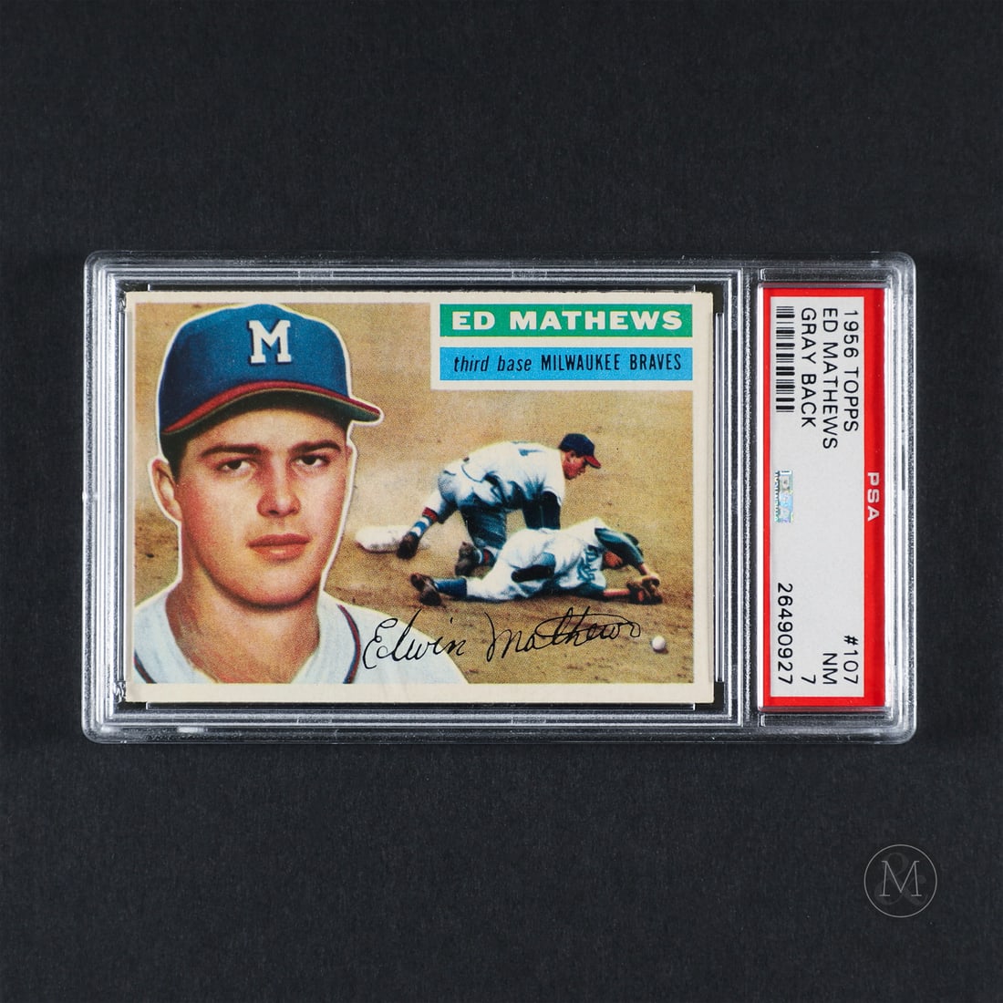 1956 Topps #107 Ed Mathews (PSA 7 NM): Offered here is the 1956 Topps Eddie Mathews card (#107). This issue is significant as a mid-1950s horizontal series entry featuring the Milwaukee Braves star third baseman. Eddie Mathews played 17