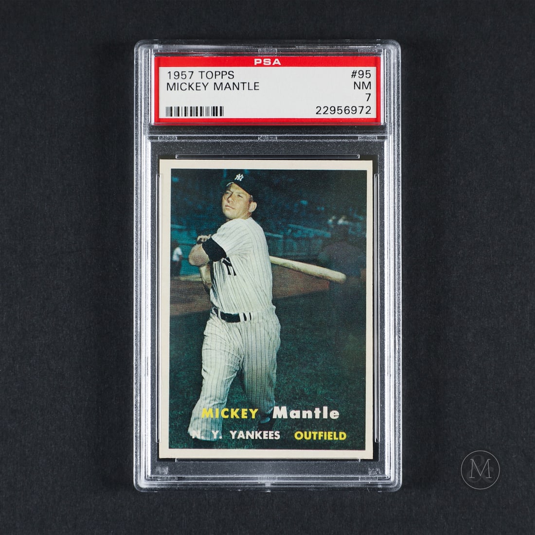 1957 Topps #95 Mickey Mantle (PSA 7 NM): Offered here is the 1957 Topps Mickey Mantle card (#95). This issue is significant as part of the set that standardized modern card tracking dimensions ($2.5 \times 3.5$ inches) and featured natural