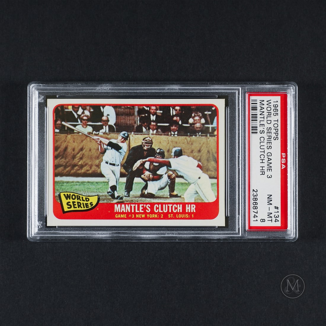 1965 Topps #134 Mantle's Clutch HR (PSA 8 NM-MT): Offered here is the 1965 Topps #134 Mantle's Clutch HR from the World Series insert subseries. The card highlights Mickey Mantle's 16th Home Run in World Series play, passing Babe Ruth's previously