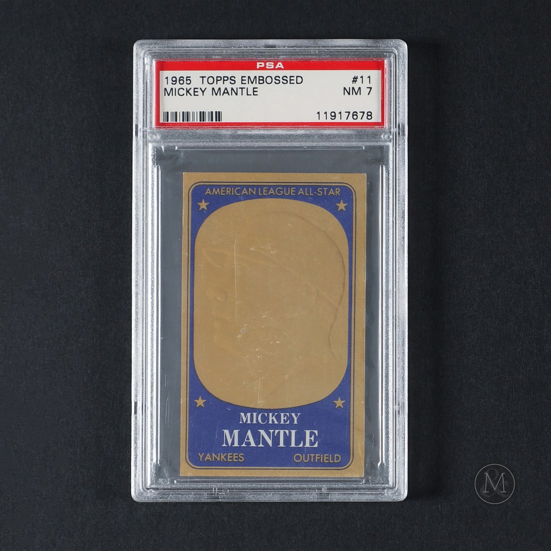 1965 Embossed #11 Mickey Mantle (PSA 7 NM): Offered here is the 1965 Topps Embossed Mickey Mantle insert card (#11). This insert issue is significant for utilizing an innovative manufacturing process that stamped a raised, gold-metallic