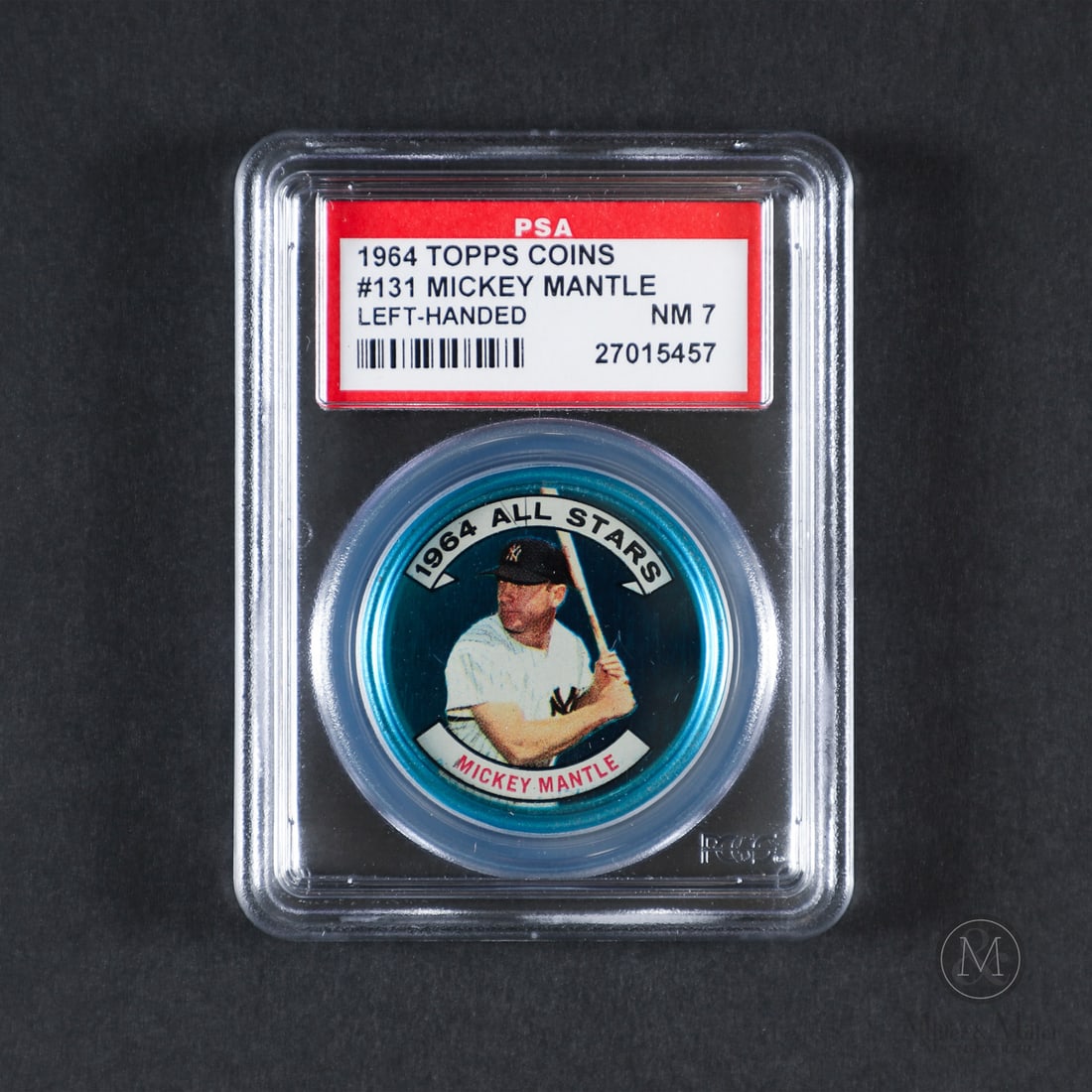 1964 Topps Coins #131-LH Mickey Mantle (PSA 7 NM): Offered here is the 1964 Topps Mickey Mantle metal coin insert (#131-LH, Left Hand variant). This production variation is highly significant as it captures Mantle in a switch-hitting batting stance