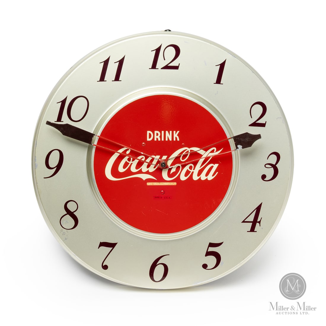 Coca-Cola Wall Hanging Clock: Made in U.S.A. 1951-1959. Single-sided tin (SST). After absorbing the Telechron brand in 1951, General Electric produced these clocks until the late 1950's when Coca-Cola began to commission