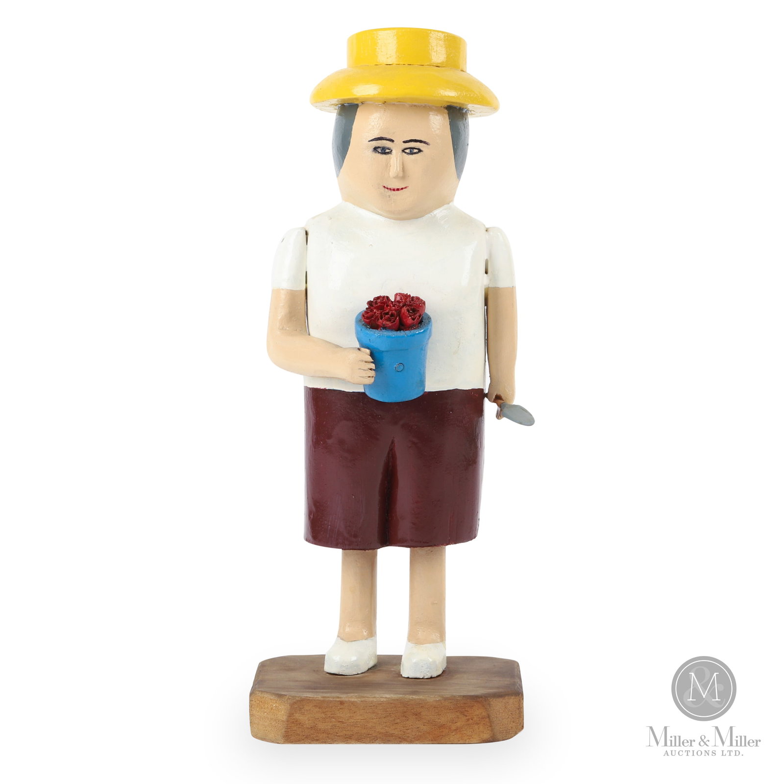 Phyllis Cosman Rose Gardener: Avonport, Nova Scotia. 2001. Polychrome painted, carved wood. Unpainted hardwood base. A finely detailed portrait of a community gardener. The figure is complete with its original bright yellow sun ha