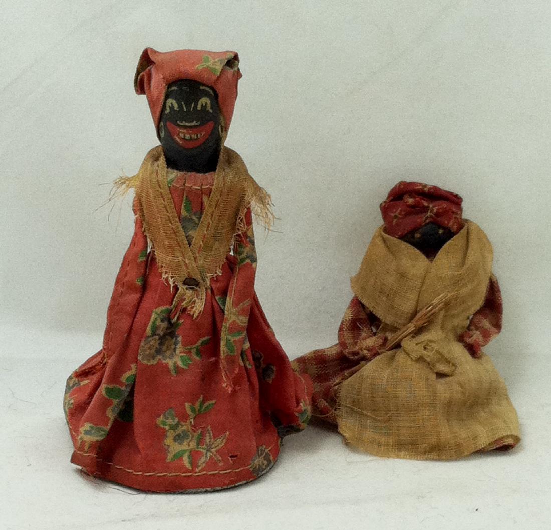 2pc. Lot.Old Black Dolls Early 20th 1 is a bell: An interesting lot. First we have the old bell that has been fashioned into a black face mammy type figure. The 4 1/4" tall metal bell has a nice clear ring but it does show some oxidation to the unde
