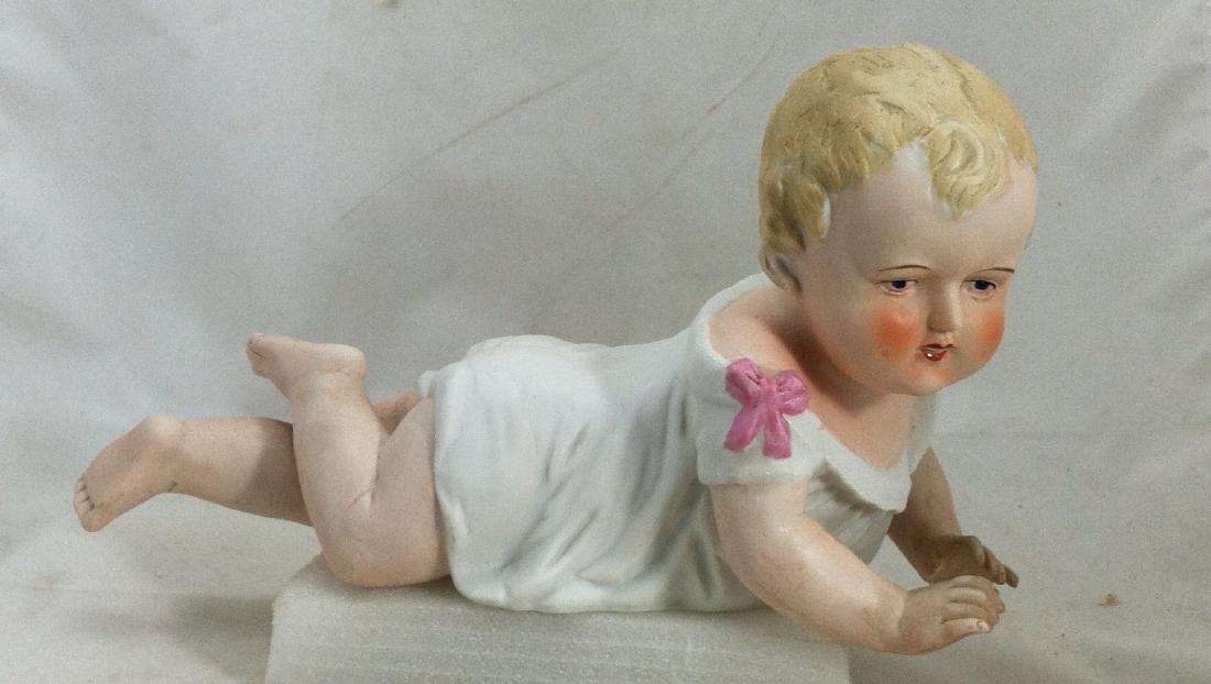 Big Antique Bisque Boy Piano Baby: Beautiful antique piano baby is 10" long & 4 3/4" wide. . No damage. Only marks on the bottom are in red-ink "23/109". Common scuffing to the knees..nothing deadly but not un-exoected.