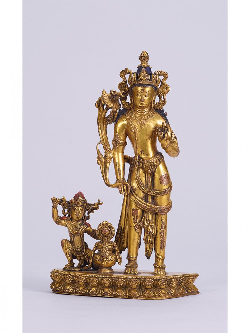 A RARE GILT-BRONZE GROUP OF VAJRAPANI AND ACALA (1 of 1)