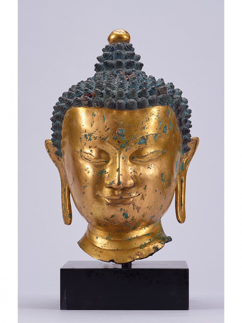 A GILT-BRONZE HEAD OF BUDDHA (1 of 1)