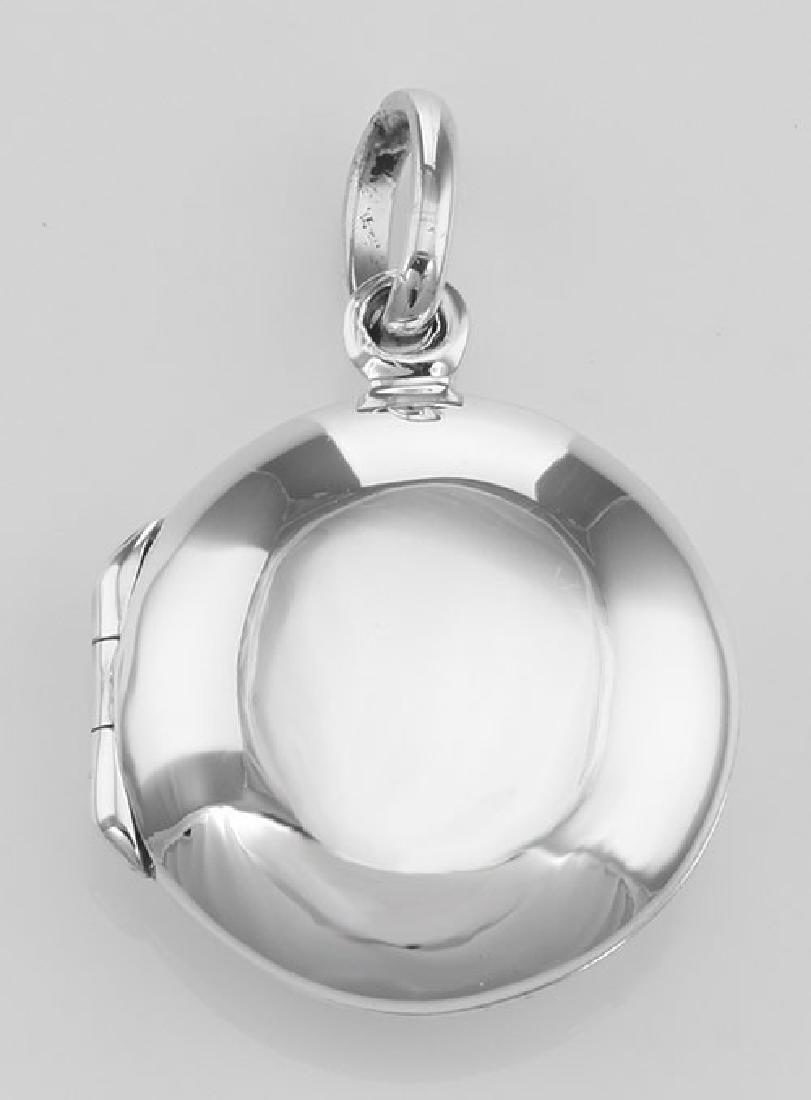 Cute Round Sterling Silver Locket - Engravable: Cute Round Sterling Silver Locket - Engravable **|**|** #HP-302 Sterling Silver Sweet Little Round Locket Pendant This Round Sterling Silver Locket opens to hold 2 photos. This pendant is polished smo