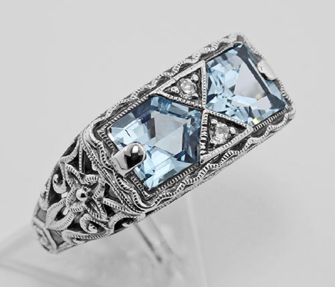 Antique Style 2 Stone Blue Topaz Filigree Ring Sterling: Antique Style 2 Stone Blue Topaz Filigree Ring Sterling Silver **|**|** #FR-475-BT This beautiful filigree ring has two large unique cut blue topaz gemstones and two small CZs and is handcrafted and f