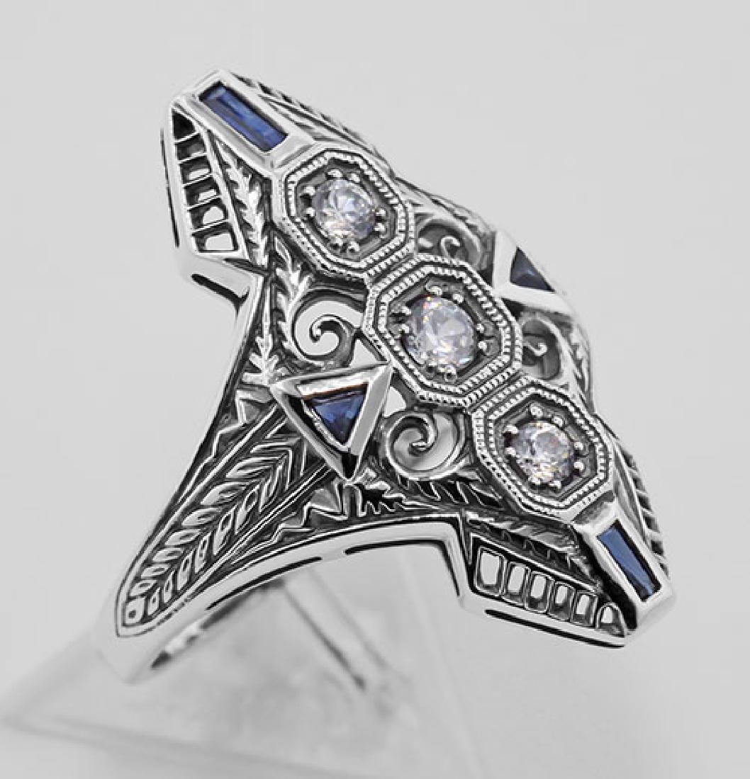 Art Deco Filigree Ring CZ / Sapphires Sterling Silver: Art Deco Filigree Ring CZ / Sapphires Sterling Silver **|**|** #FR-60 Sterling Silver Art Deco Style Filigree Ring w/ CZ / Sapphires. This ring features 3 dazzling CZs each prong set and stacked verti