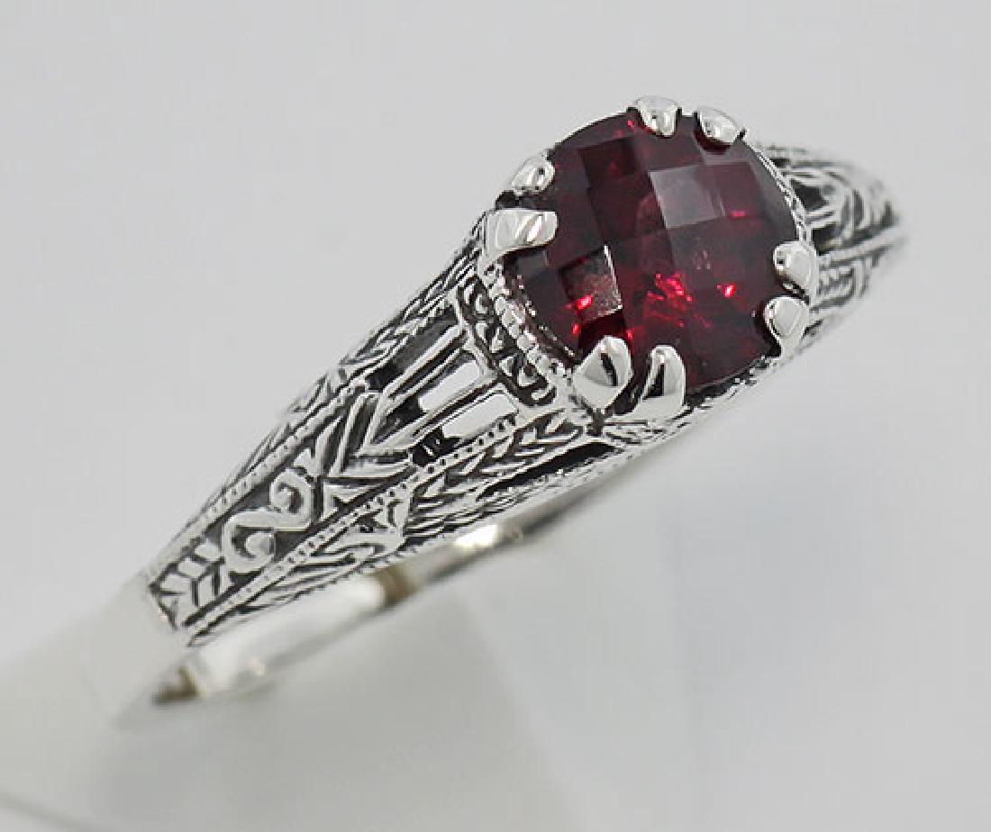 Garnet Filigree Ring - Sterling Silver: Garnet Filigree Ring - Sterling Silver **|**|** #FR-701-G Metal : Sterling Silver | Stone : Garnet | Style : Rings | Height : 1/4 inch | Width : 3/4 inch | Approximate Weight : 2.6 grams | Carat : 3/4