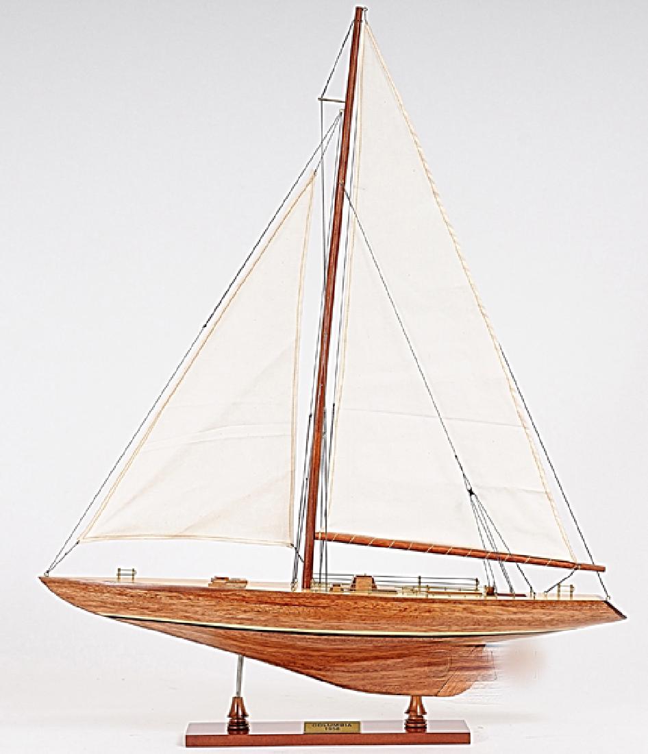 HAND MADE WOODEN Columbia Ship W/COA: HAND MADE WOODEN Columbia Ship W/COA **|**|** Size: 60L x 12W x 79H (cm) Description: The Columbia yacht was built in the Nevins Yacht by Olin Stephens who brought all his vast and sound experience in