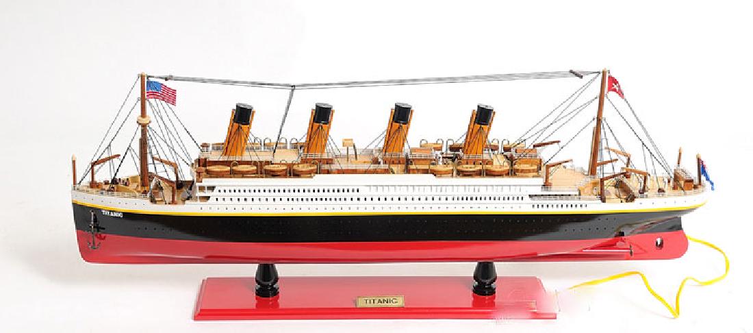 HAND MADE WOODEN TITANIC WITH LIGHTS W/COA: HAND MADE WOODEN TITANIC WITH LIGHTS W/COA **|**|** In May 1911 Titanic was launched which was a heavily publicized spectacle. Unfortunately at 11:40 pomp on the 14th April 1912 the greatest maritime 