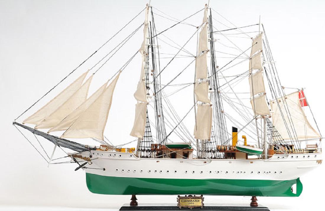 HAND MADE WOODEN DANMARK W/COA: HAND MADE WOODEN DANMARK W/COA **|**|** Dimensions: 70L x 13W x 61H (cm) Description: Display this model of the 253 foot full-rigged ship built and launched in 1932 in Lolland Denmark right in your ow