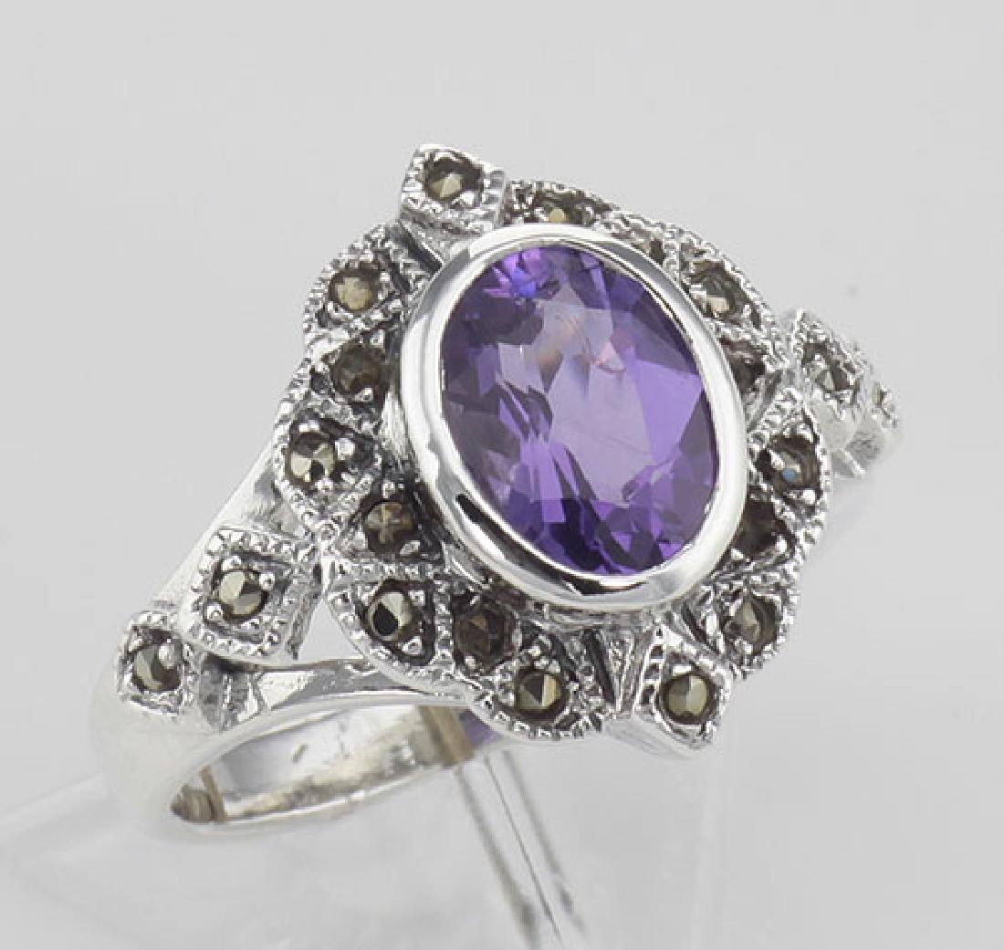 Lovely 1 Carat Genuine Amethyst and Marcasite Ring - St: Lovely 1 Carat Genuine Amethyst and Marcasite Ring - Sterling Silver **|**|** #R-406-AM This lovely Amethyst Ring features a beautiful 1 Carat Oval Cut Amethyst Gemstone surrounded by Marcasites in a 