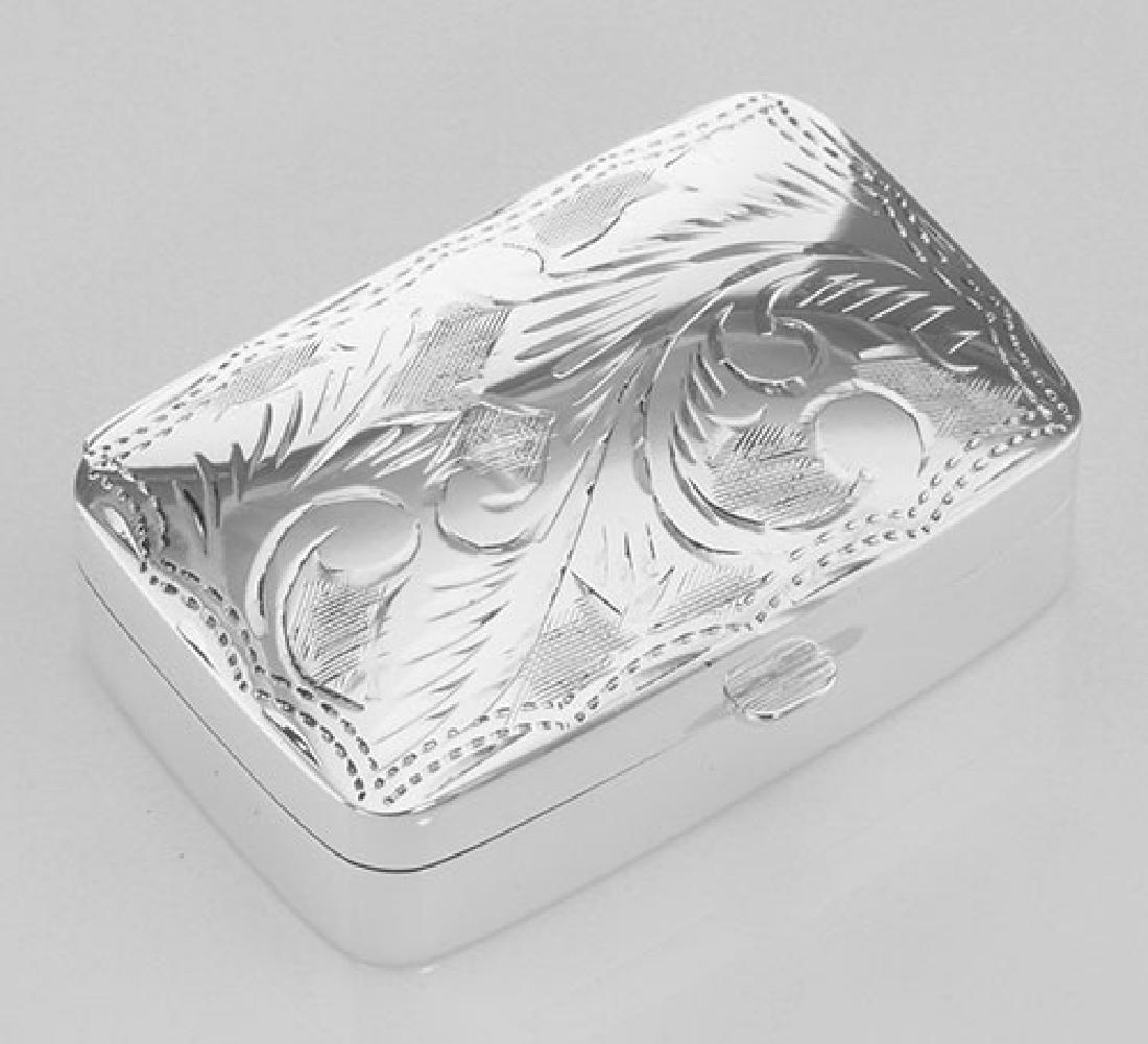 Sterling Silver Pillbox with Etched Design: Sterling Silver Pillbox with Etched Design **|**|** #X-9018 Sterling Silver Pillbox / Pill Box with Etched Design weighs approx. 14.4 grams. This pillbox measures approx. 1 3/8 inches W x 1 inch D x 7