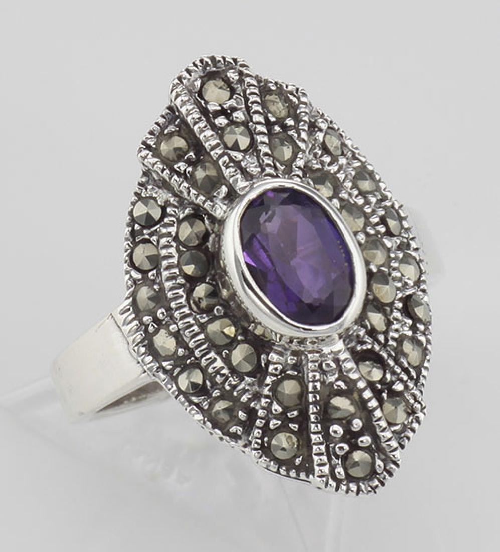 Stunning 1/2 Carat Genuine Amethyst and Marcasite Ring: Stunning 1/2 Carat Genuine Amethyst and Marcasite Ring - Sterling Silver **|**|** #R-403 This unique Amethyst Ring features a nice 1/2 Carat Oval Cut Amethyst Gemstone surrounded by two rows of gliste