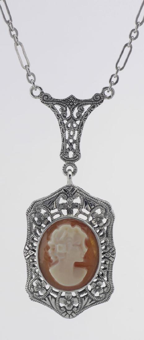Hand Carved Italian Shell Cameo Filigree Necklace - Ste: Hand Carved Italian Shell Cameo Filigree Necklace - Sterling Silver **|**|** #FP-69-SH This Sterling Silver Filigree Shell Cameo Pendant was hand carved in Italy and measures 1 inch H x 5/8 inches W a