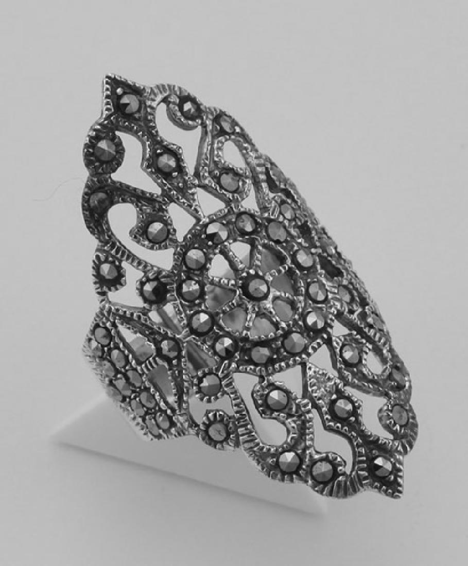 Marcasite Ring - Filigree Design - Sterling Silver: Marcasite Ring - Filigree Design - Sterling Silver **|**|** #R-600 Metal : Sterling Silver | Stone : Marcasite | Style : Ring | Height : 34.3 mm | Width : 21.6 mm | Approximate Weight : 6.4 grams | Cu