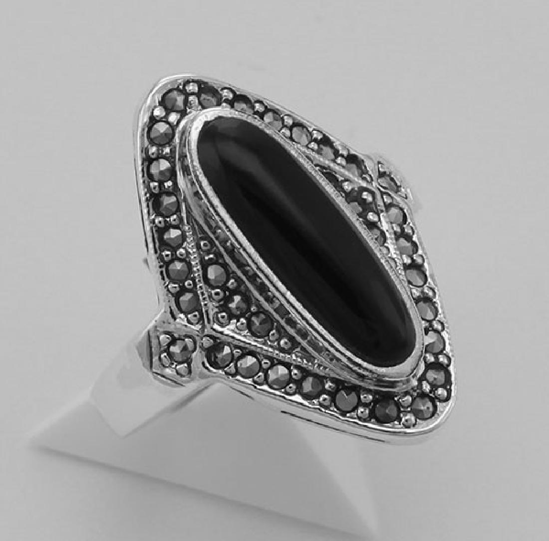 Onyx and Marcasite Ring - Sterling Silver: Onyx and Marcasite Ring - Sterling Silver **|**|** #R-408 Metal : Sterling Silver | Stone : Onyx Marcasite | Style : Ring | Height : 1 inch | Width : 3/4 inch | Approximate Weight : 5.4 grams | Cut : 