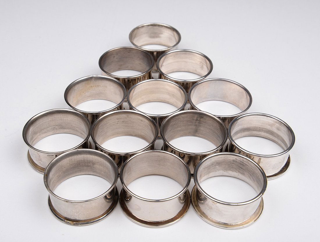 Collection of 13 Napkin Rings: 12 Silverplate rings, 1 Sterling (mark shown). All quite similar. Size: 1.75" Diameter.