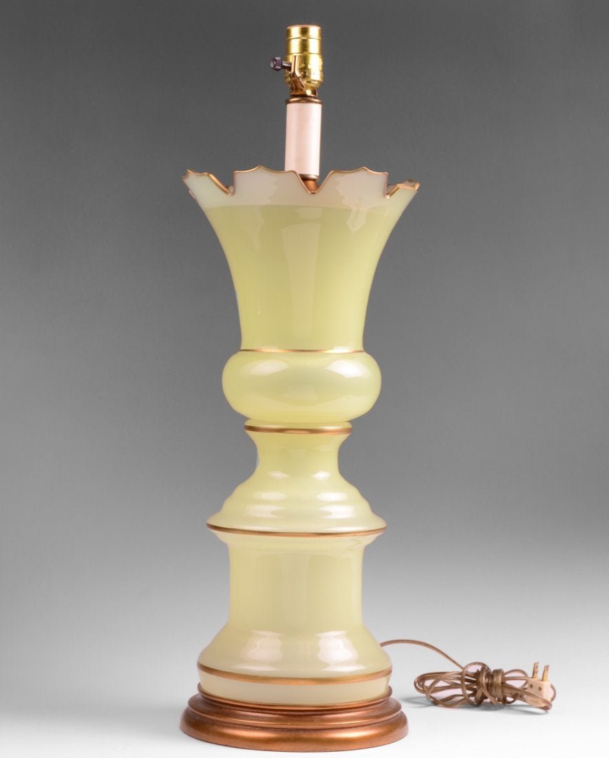 Antique Opaline Green Glass Vase Fitted As Lamp: An antique Opaline Green Glass Vase fitted as a lamp, the outlined in gilt on a gilded base.26 in Height