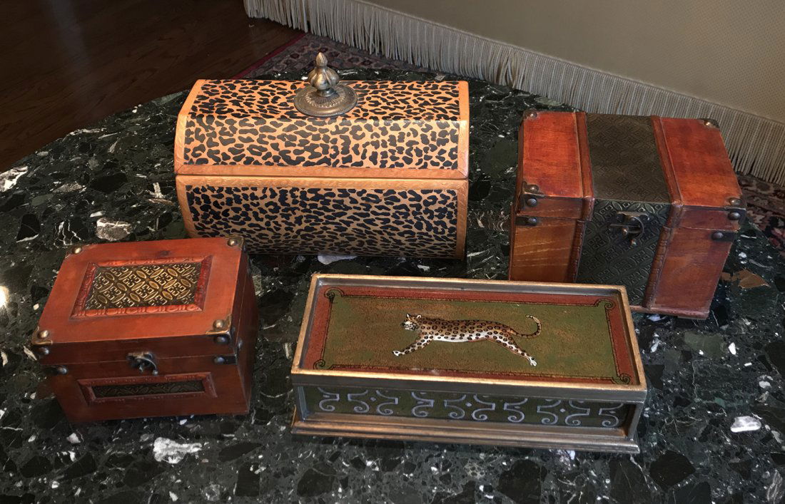 A collection of 4 Decorative Boxes: A collection of 4 decorative boxes, sizes ranging from smallest at 6" Height x 8" Width; to largest at 10" Height x 14" Width.