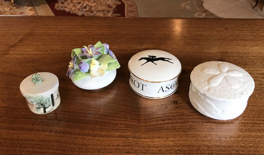 A Collection of 4 Small Decorative Boxes: A collection of 4 small mostly porcelain boxes, smallest is a stamp roll holder, 2" Height. Largest is 2" Height, 4" Diameter. Named as shown.