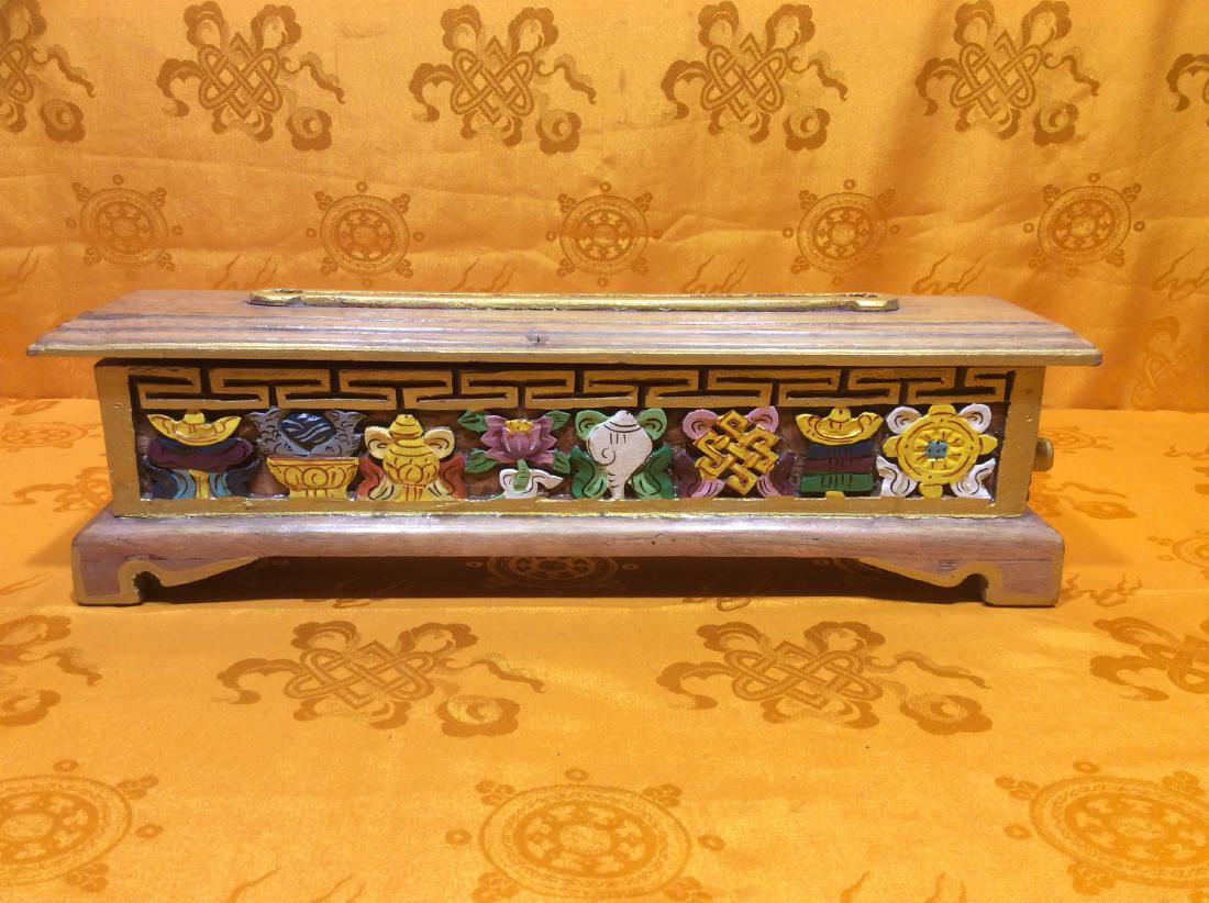 Tibetan Incense Censer: Tibetan Buddhist Wooden Incense Burner, hand crafted in Nepal with detail carving including Tibetan Eight Auspicious Symbols and painted various colors. 14" long 4" high and weighs 636 grams.