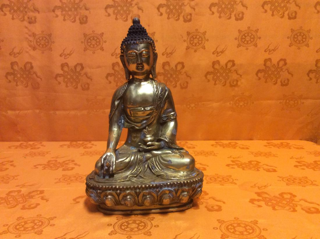 Old Tibetan Seated Buddha: Tibetan old, hand-made and blessed seated on Lotus throne Buddha Statue holing a Long Live Vase made with carved and gilted bronze. Size 11.5" tall, 7" wide and weighs about 1,700 grams.