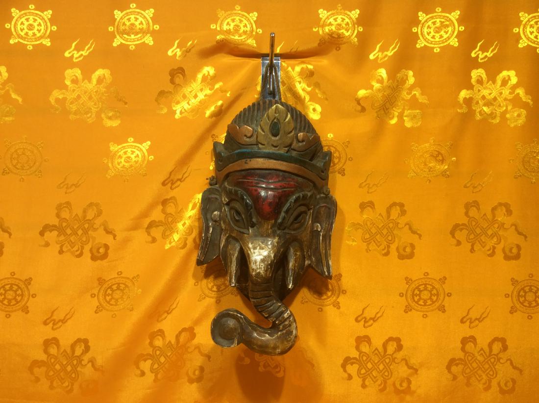 Vintage Wooden Ganesh Mask.: 12" Vintage Wooden Ganesh Mask, hand crafted in Nepal in around 1950s. Ganesh is God of Wealth and Obstacle Remover. Size is 12" tall, 7" wide and weighs 510 grams.