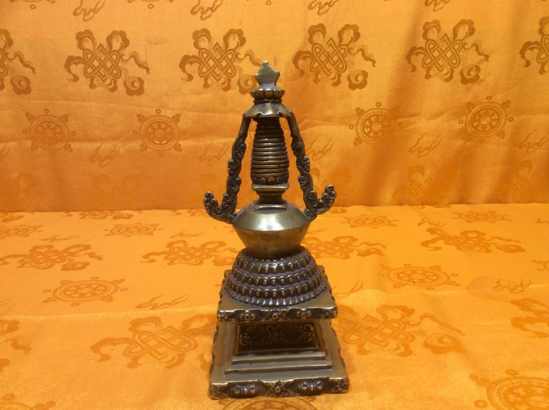Antique Tibetan Stupa.: Antique Tibetan Buddhist Stupa made with solid bronze. Made in Tibet in 18th/19th Century with very detal carving and Buddhist designs. 7"x4"x4" and weighs 686 grams. One-Of-A-Kind-Piece!