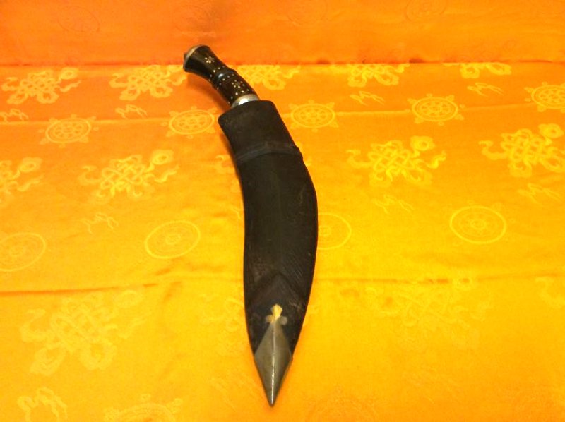 Antique Gorkha Knife.: Antique Gorkha Knife (Khukuri) from Nepal made with solid steel blade and wooden case covered with leather. Over all length is 17" and steel blade is 12" long. Great condition. One small side knife is