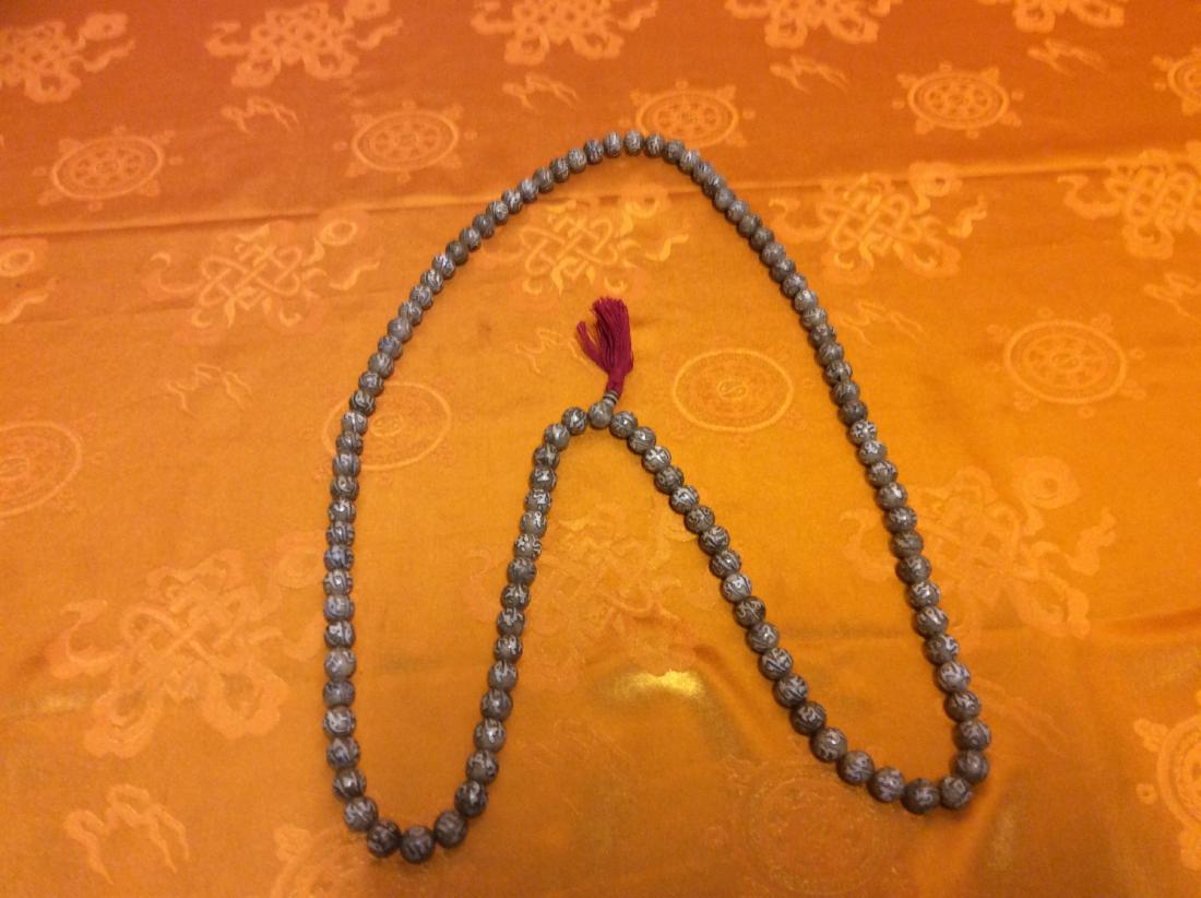 Tibetan Mala Beads.: Tibetan Buddhist Mala Beads made with Lotus Seeds. Each beads are carved with "Om Mani Ped Me Hung" meaing May All Living Beings Be Free From Sufferings. This Mala was made in Nepal by a Tibetan Artis