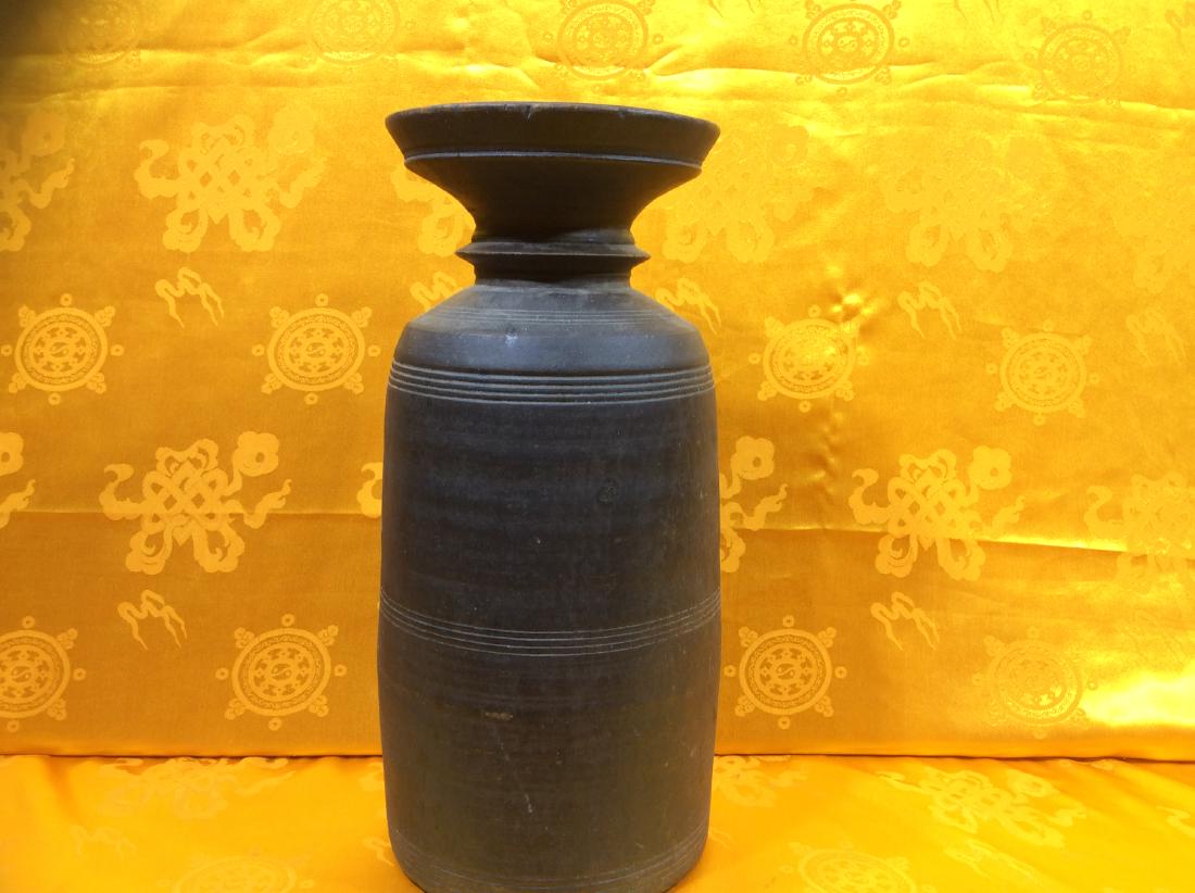 Antique Wooden Pot.: Antique Wooden Pot, hand carved in Nepal possibly in late 19th Century and used for storing cooking oil, milk, yogourt, etc. Measures 13" high, 6" wide and weighs 998 grams.