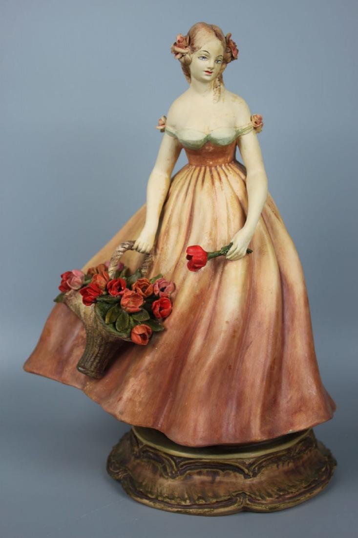 Capodimonte Guido Cacciapuoti Figurine "Lady w Flowers": MANUFACTURE: Guido Cacciapuoti (Italy) NAME: Lady with Basket of Flowers ISSUED: 1930-th CONDITION: Minor damages of flowers. NO BOX. HEIGHT: 11 inch / 27 cm WIDTH: 7 1/2 inch / 19 cm DEEP: 6 1/2 inch